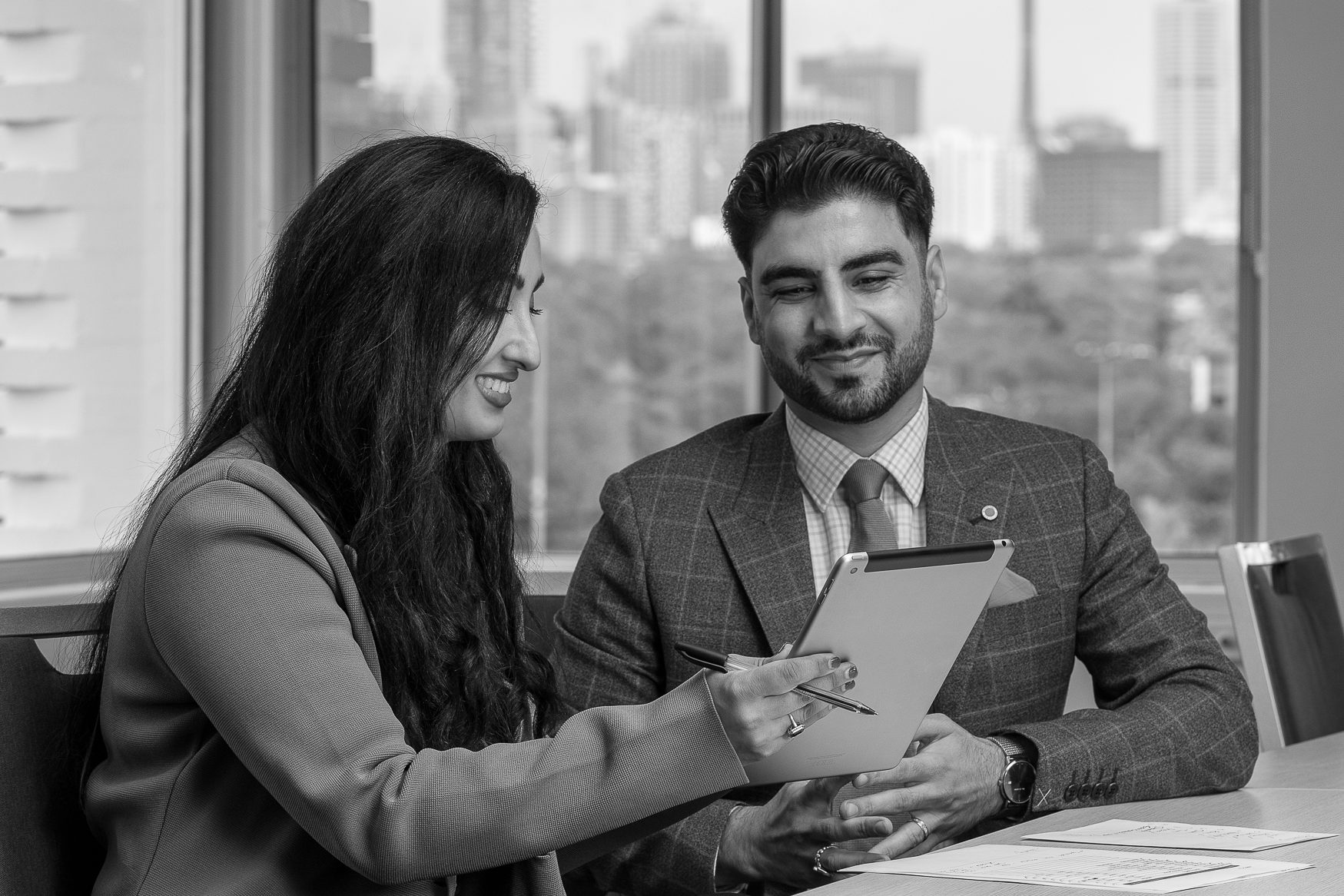 Lex Law Australia partners Shahri Rafi and Tariq Kareemi collaborating in the office